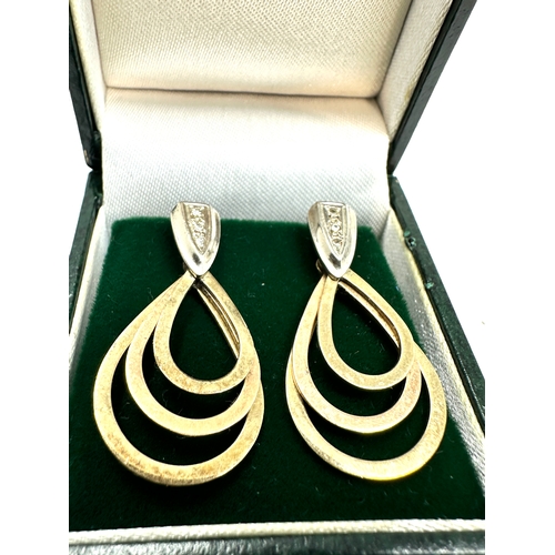 107 - 9ct gold & diamond set graduated hoop earrings measure approx 3.1cm drop weight 6.4g