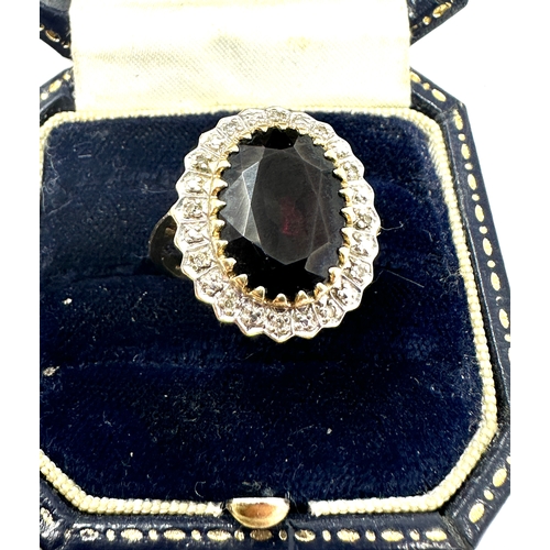 113 - large dark red gemstone & diamond halo ring weight 5.6g