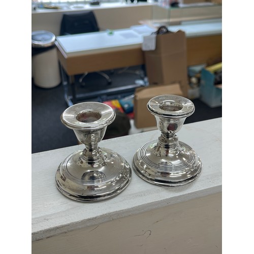 537 - Pair of filled Chester silver candle sticks