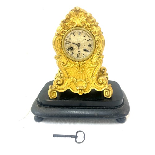 30 - Victorian brass clock on stand under glass dome - dome has sustained damage.
Overall height 16.5 inc... 