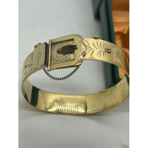 517 - 9ct rolled gold hand made bangle