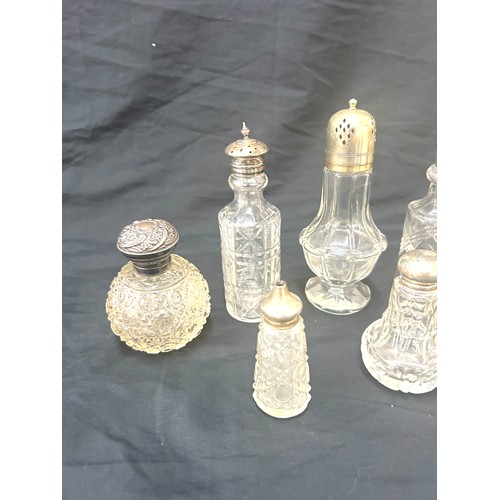 88 - Six glass bottles with silver and silver plate tops tallest measures approx 6.5 inches