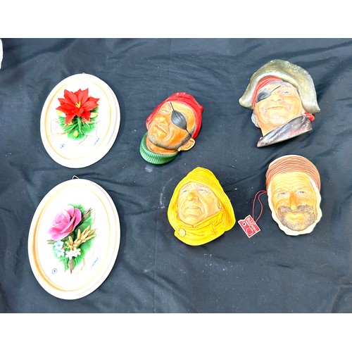 46 - Four Bossons chalk wall masks and two floral wall plaques