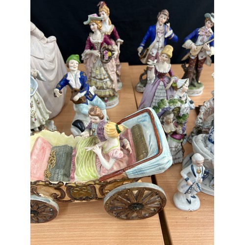 113 - Large selection of vintage porcelain lady and gent figures and a musical carriage figure  tallest me... 