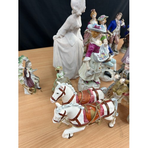 113 - Large selection of vintage porcelain lady and gent figures and a musical carriage figure  tallest me... 