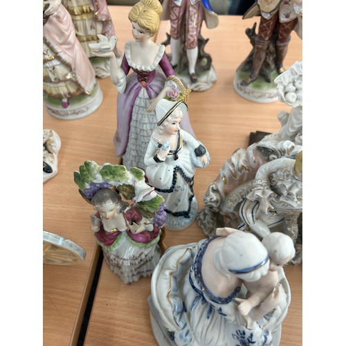 113 - Large selection of vintage porcelain lady and gent figures and a musical carriage figure  tallest me... 