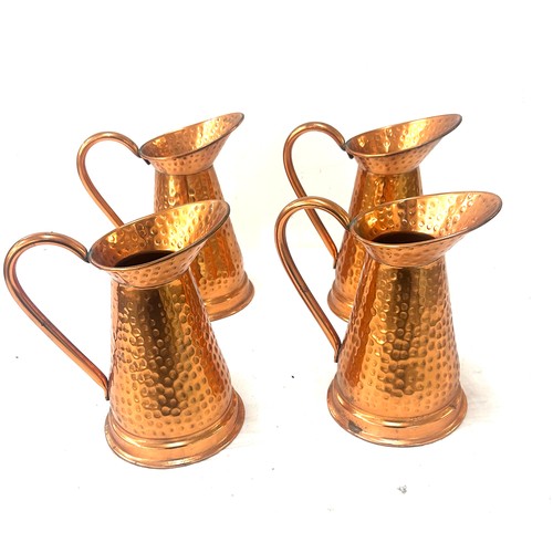 10 - Four copper jugs overall height 8.5 inches