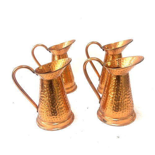 10 - Four copper jugs overall height 8.5 inches