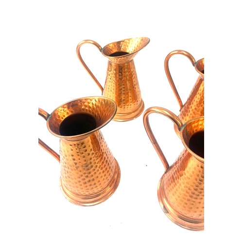 10 - Four copper jugs overall height 8.5 inches