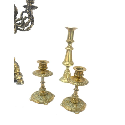 53 - Selection of vintage brass candle sticks tallest measures approx 14 inches tall