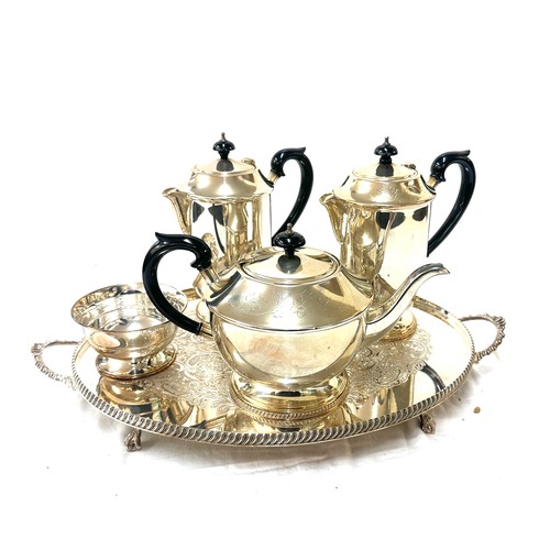 568 - Two silver plated jugs, a tea pot, sugar bowl and tray