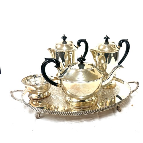 568 - Two silver plated jugs, a tea pot, sugar bowl and tray