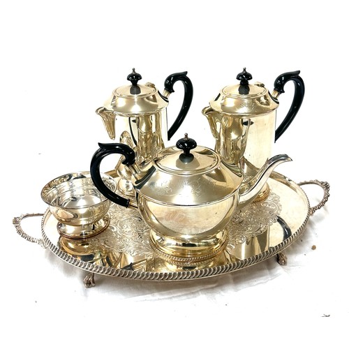 568 - Two silver plated jugs, a tea pot, sugar bowl and tray