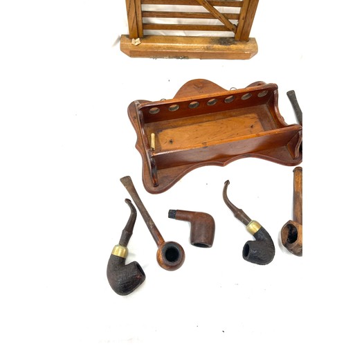 120 - Vintage wooden smking pipe stands and a selection of smoking pipes