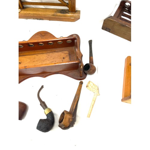 120 - Vintage wooden smking pipe stands and a selection of smoking pipes