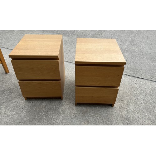 394 - Pair of two drawer oak bed side table measures approx 22 inches tall, 16 wide and 19 deep