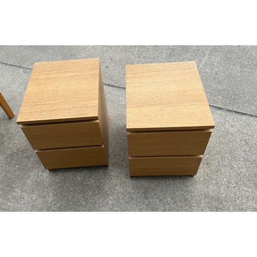 394 - Pair of two drawer oak bed side table measures approx 22 inches tall, 16 wide and 19 deep