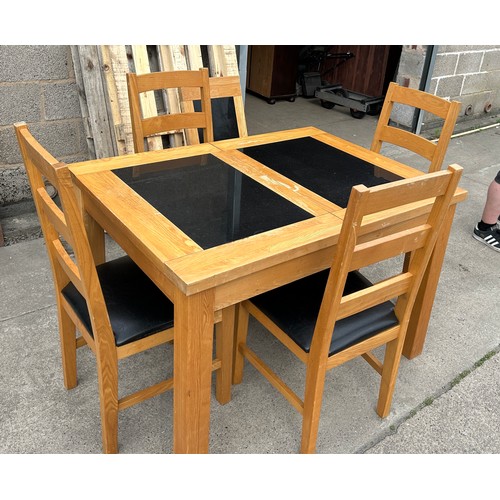 391 - Oak and marble extending table and four chairs measures approx without leaf 31 inches tall, 36 wide ... 