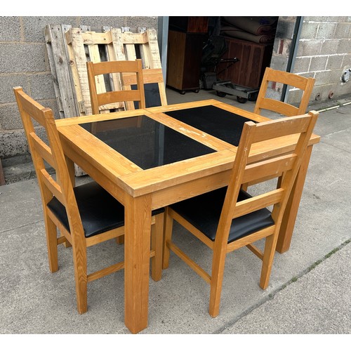 391 - Oak and marble extending table and four chairs measures approx without leaf 31 inches tall, 36 wide ... 