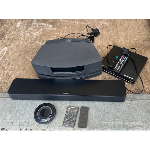 387 - Bose sound system with remotes and a dvd player in working order