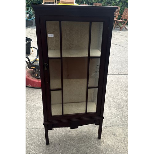 382 - Glass fronted cabinet measures approx 50 inches tall, 23 wide and 11 deep