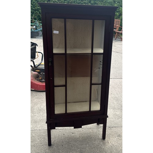 382 - Glass fronted cabinet measures approx 50 inches tall, 23 wide and 11 deep