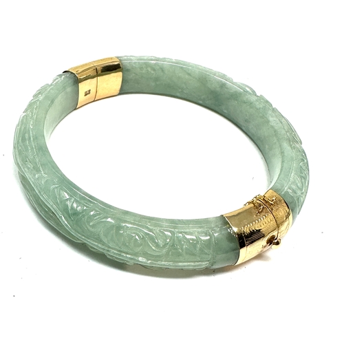 90 - 14ct gold carved jade bangle weight 58g