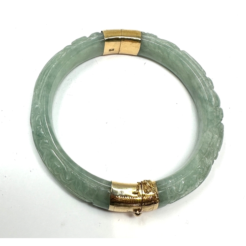 90 - 14ct gold carved jade bangle weight 58g