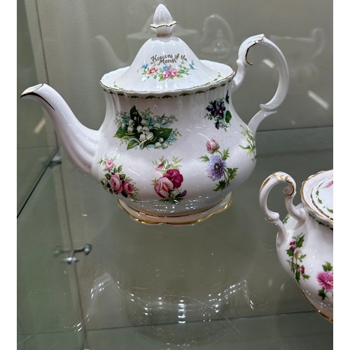 297 - Royal Albert Flower Of The Month Teapot, cream and sugar set, all Second quality, good overall condi... 