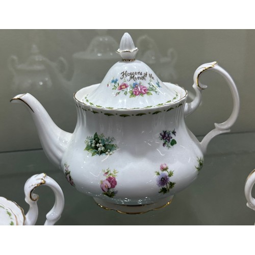 298 - Royal Albert Flower Of The Month Teapot, 2  Sugar lidded jats, all of second quality, all in good ov... 