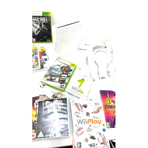 277 - Wii gaming console with a variety of games - no power leads/ one game black ops is not present the r... 