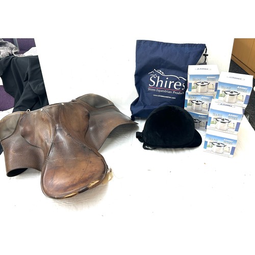 317 - Horse saddle, riding helmet and sunnex tea pots