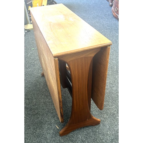 396 - Teak drop leaf table measures 54 wide, 36 deep and 29 high