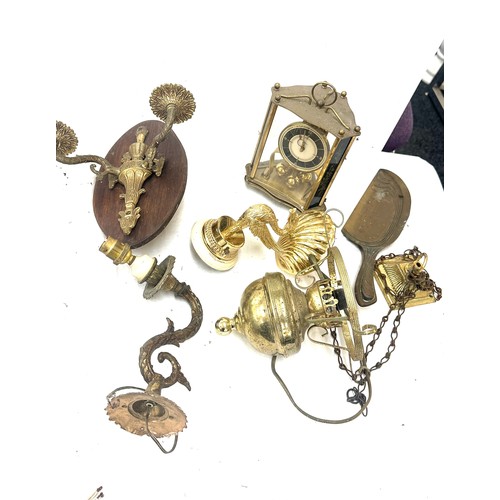 345 - Selection of brass items to include candle holders, clock, oil lamp, flat irons, cutlery etc