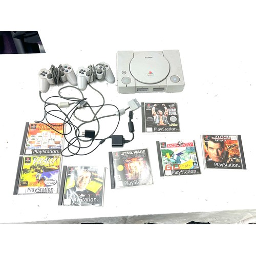 95 - Playstation One with controllers and 7 games, untested, to include Star Wars, Monopoly, War zone etc... 