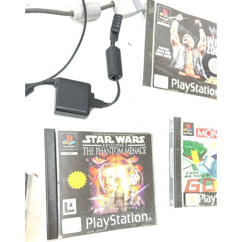 95 - Playstation One with controllers and 7 games, untested, to include Star Wars, Monopoly, War zone etc... 