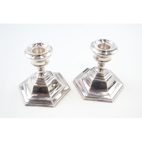 46 - 2 x .925 sterling weighted candlesticks