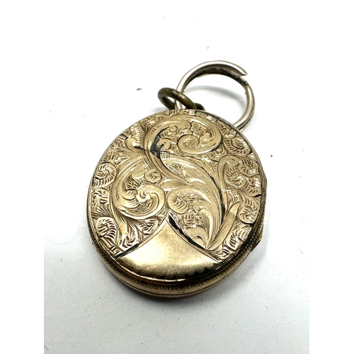 96 - Antique 9ct gold back & front enamel locket measures approx 2.9cm drop