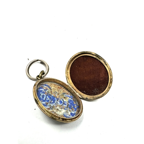 96 - Antique 9ct gold back & front enamel locket measures approx 2.9cm drop