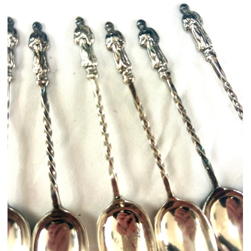 378 - 800 grade silver apostle teaspoons and sugar tongs, total weight 142g