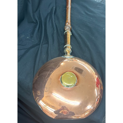 97 - Selection of copper and brassware to include a bed warming pan, large jug, kettle etc, jug measures ... 