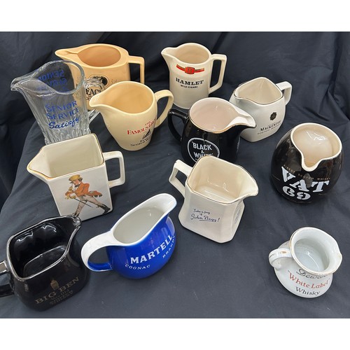 77 - Selection of 12 vintage advertising jugs