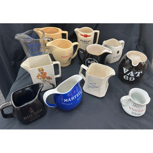 77 - Selection of 12 vintage advertising jugs