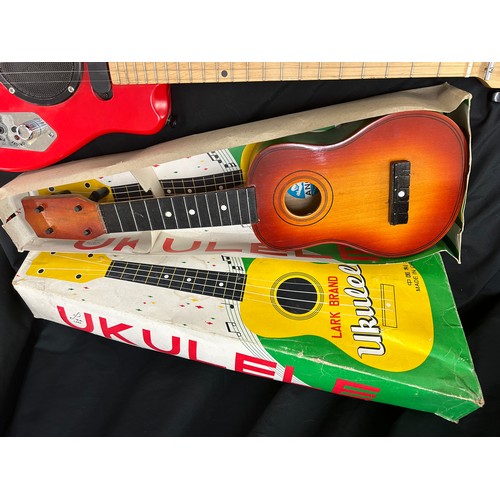 110 - Ukulelu and childs electric guitar, untested