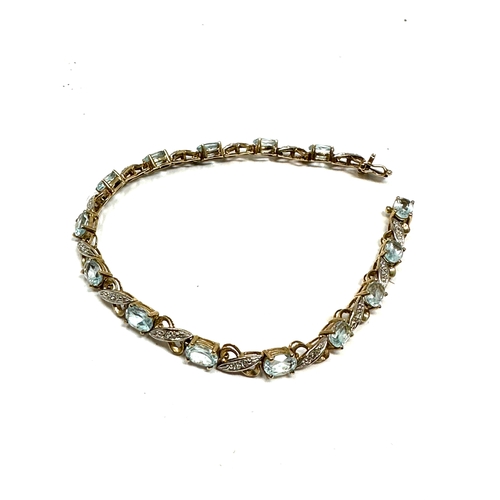 98 - 9ct gold topaz & diamond tennis bracelet weight 10g