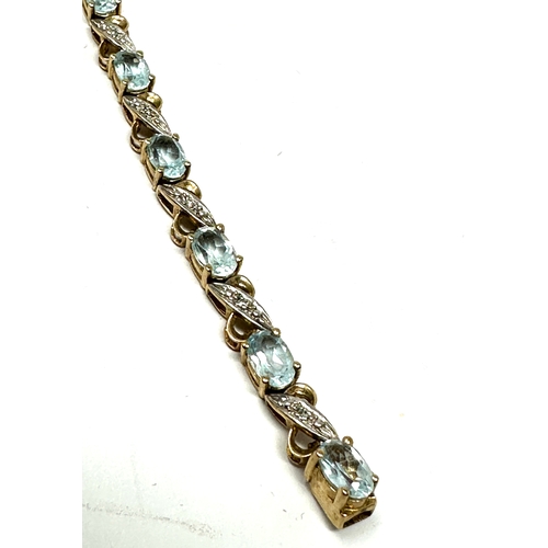 98 - 9ct gold topaz & diamond tennis bracelet weight 10g