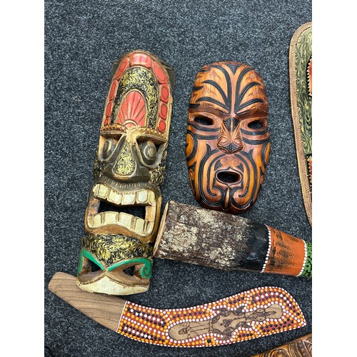 215 - Selection of tribal souvenir wooden wall masks, aboriginal pieces