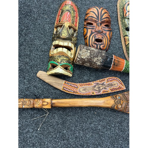 215 - Selection of tribal souvenir wooden wall masks, aboriginal pieces