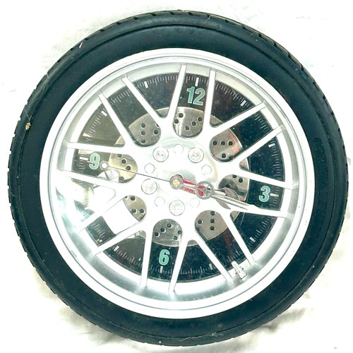 76 - Novelty Tyre wheel wall clock, approximate diameter 14 inches