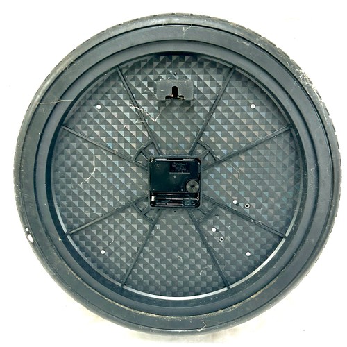 76 - Novelty Tyre wheel wall clock, approximate diameter 14 inches